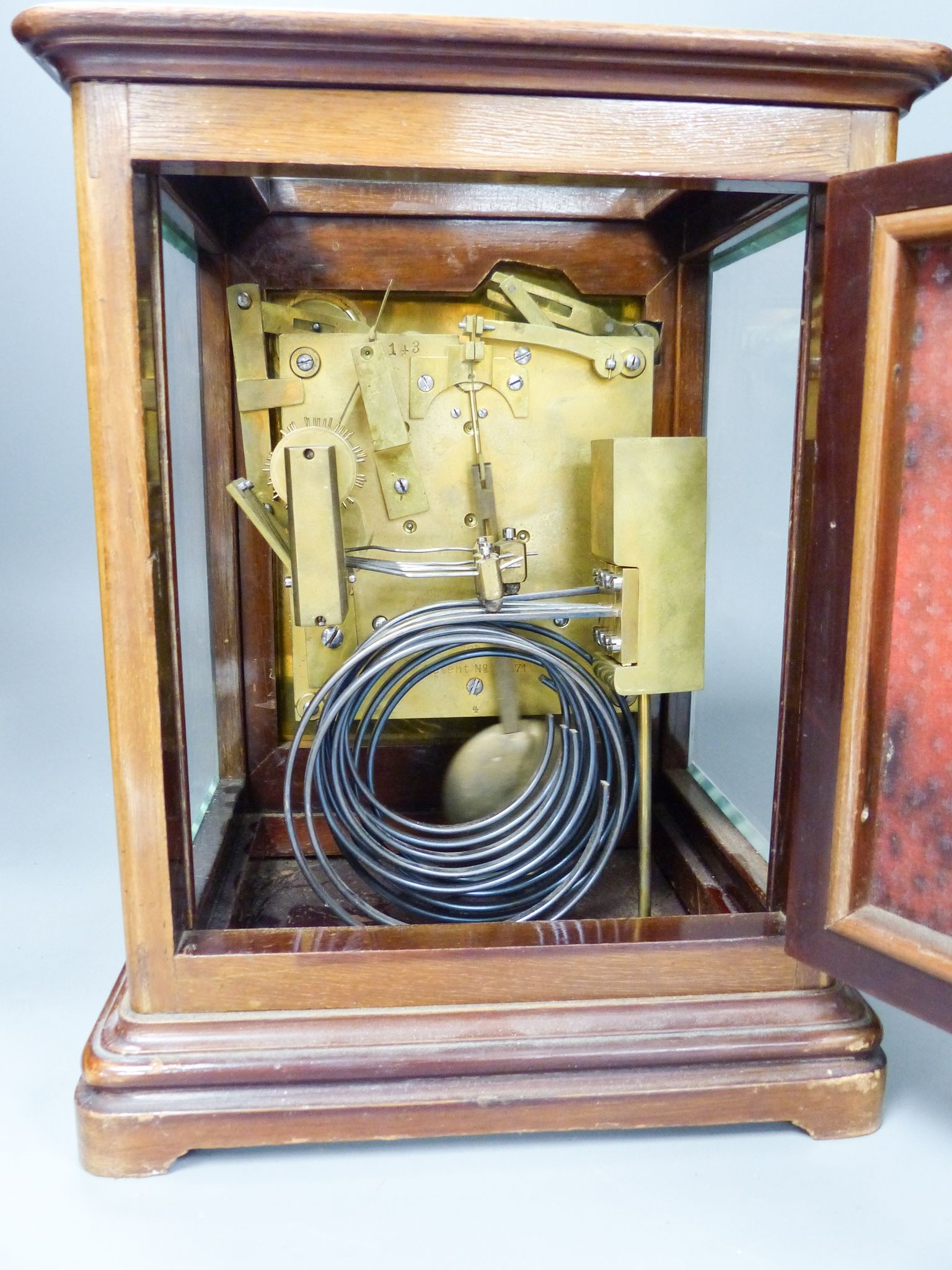 A chiming 4 glass mahogany mantel clock, retailed by Birch and Gaydon with silvered dial, 26.5 cm high 27cm